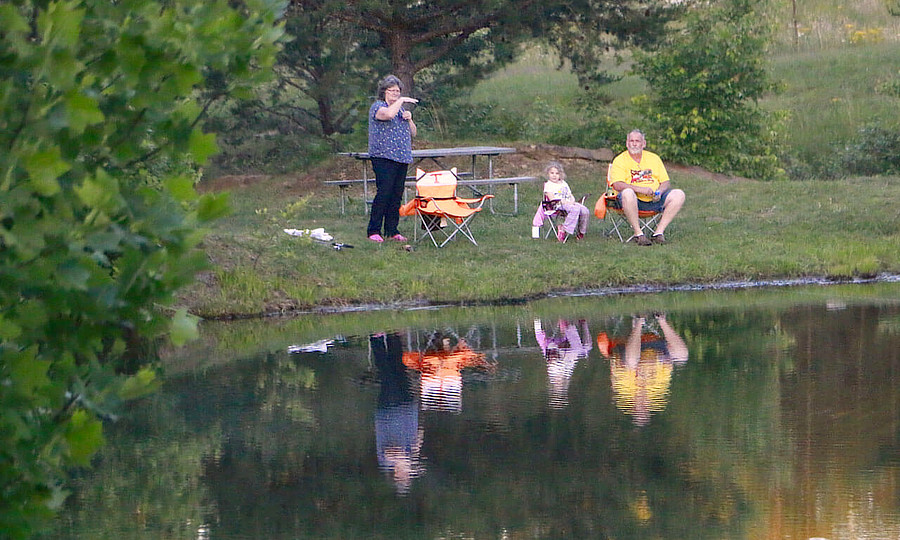 Couple sitting by the lake